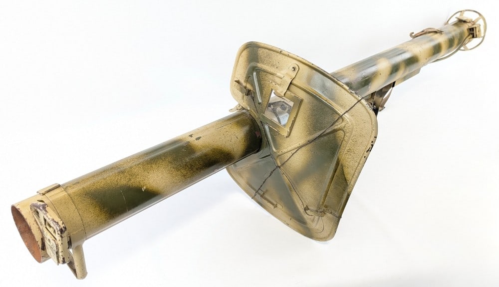 Reproduction WWII German Panzerschrek Rocket Launcher: Believed to be a reproduction with numbers and letters stamped above the trigger guard that do not match any know examples so bid accordingly. Tube and shield have a custom tan and green painted finis