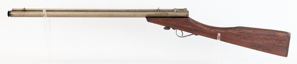 Benjamin Air Rifle Co. Model F Air Rifle: Rifle is in good condition with an oxidation over the nickel finish, and general scuffs and dings on the stock from use and age. Measures 36-1/2in long. Ref #: 1005
