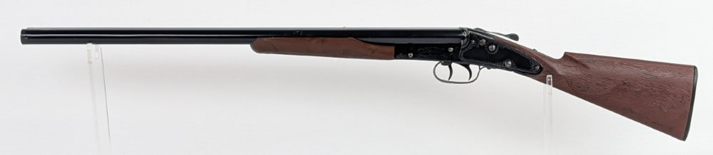 Vtg Daisy Mfg Co. Model No. 410 Double Barrel Pop Gun: The gun features a break action cocking mechanism, dual triggers, metal double barrel, and plastic wood style stock. The gun displays well with engravings on the receiver. Mechanically functions. Has