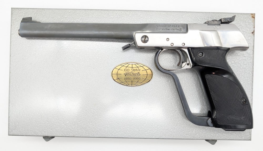 100th Anni Walther LP Model 2 .11 Cal BB Target Air Pistol w/ Case: Pistol is in good condition and does have heavy dented around the frame of the rear sight, and other scuffs and wear from use and handling. Barrel length measures 9-1/2in. SN: 13436 Ref #: 1025