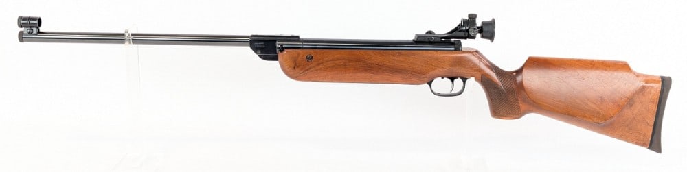 Walther LG Model 55 .177 Cal Target Air Rifle: Features an original Walther rear peep sight and floating ring front sight, a 17-3/4in barrel, and a heavy target stock with a cheek rest. Rifle is in very nice condition with light wear from handling