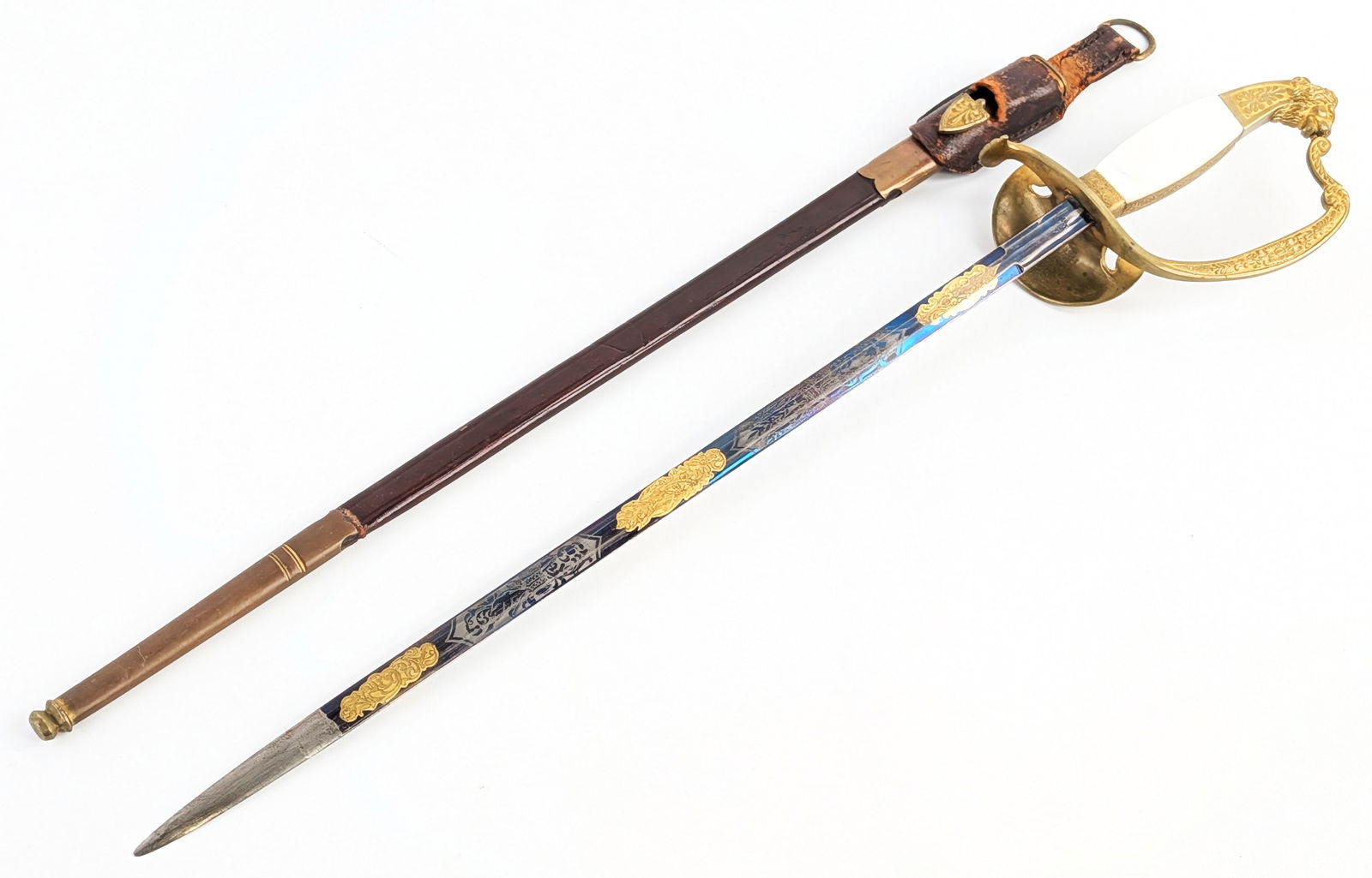 WWI Imperial German Prussian Carl Eickhorn Diplomat Court Sword w/ Scabbard & Frog: Features a blued finish blade with gold accents, a cast brass guard with a lion on the clam shell, mother of pearl handle scales with the Prussian crown, and a cast brass pommel of a lions head. Sword