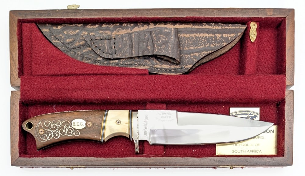 Stephen Mackrill Special Design Bowie Knife w/ Sheath & Case: Features a mirror polished blade with a 3/4 sharpened top edge, a file worked nickel silver single guard, brass spacers, mosaic handle pins, exotic bone and iron wood handle scales with wire inlay and