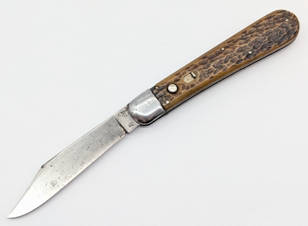 Remington Master Knife Jig Bone Push Button Switchblade R2403: Knife is in fair cleaned condition with scratches and carbon spots on the blade, scuffs and dings on the bolsters, and a chip and crack on the front handle scale. Blade spring is nice and strong, but