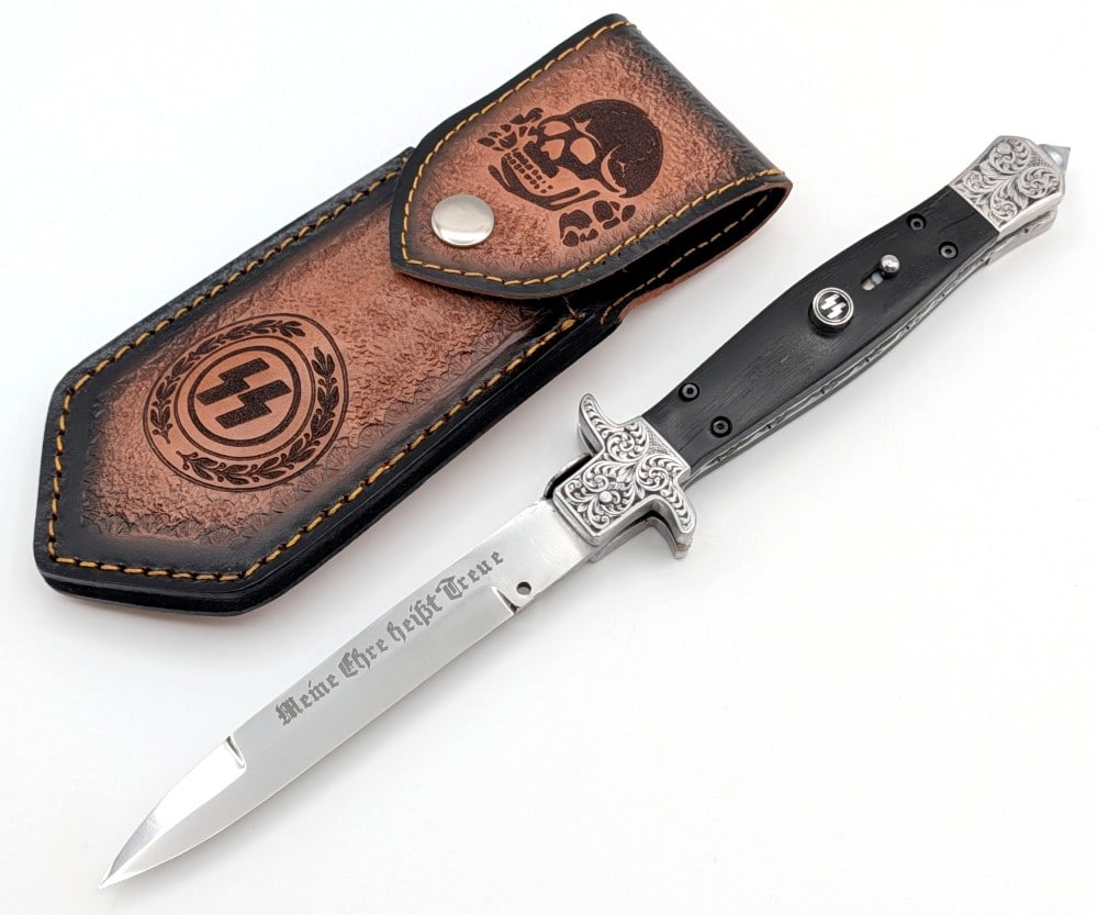 Custom German SS Deaths Head Picklock Stiletto Switchblade w/ Sheath: Features a mirror polished blade with the phrase "Meine Ehre Hei?t Treue" (My Honor is Loyalty) the motto of the German SS, engraved bolsters with a serpentine guard, Totenkoph etching on the pick loc