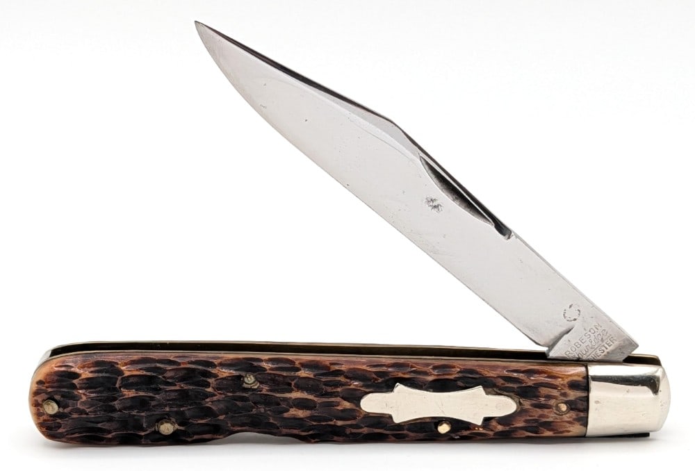 Antique Robeson ShurEdge Jig Bone Lockback Knife 61272: Knife is in nice condition with a few spots of pitting on the polished blade, light scuffs on the polished bolsters, and nice handle scales. Overall measures 4-1/2in when closed.
