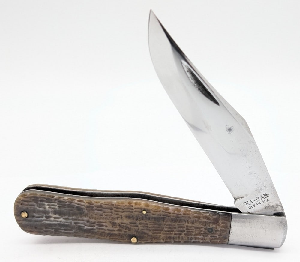 Vtg Ka-Bar Green Bone Coke Bottle: Knife is in nice cleaned condition with light scratches and carbon spots on the polished blade, light scuffs and dings on the bolsters, and nice handle scales. Overall measures 5-3/8in when closed.