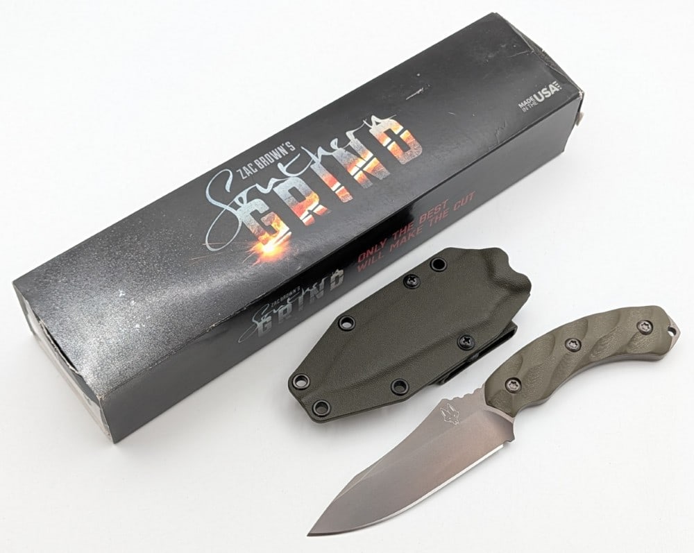 Zac Brown Southern Grind OD Green Micarta Jackal w/ Sheath & Box: Features a gunmetal PVD finish on the blade, thumb notched blade, textured OD green micarta handle, and a lanyard hole. Knife is in like new condition. Blade length measures 4-1/2in and overall 9-1/4i