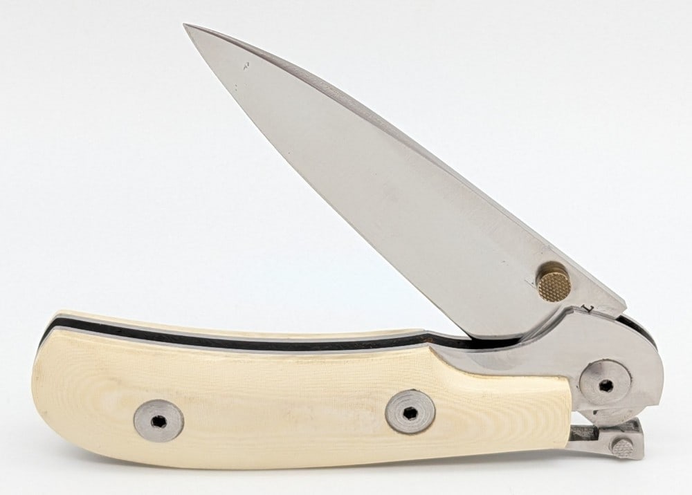 A.G. Russell Paper Micarta One Hand Knife: Knife is in nice condition with light scuffs on the blade and handle. Overall measures 4in when closed.