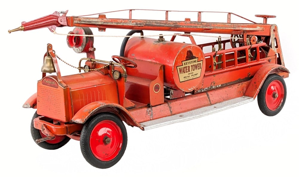 Keystone Packard Water Tower Fire Truck w/ Real Pump: Keystone Packard water tower fire truck with real pump. The truck has replacement decals and the ladders were repainted, but otherwise appears to be original. The cranks for the tower work, but unsure
