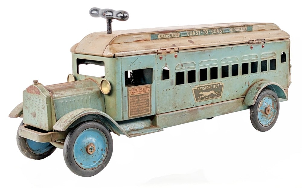 Original Keystone Packard Coast-To-Coast Bus: Original Keystone Packard Ride 'Em Coast-To-Coast bus. The bus shows some discoloration, paint loss, and wear from play / age. The driver side front tire appears to be a period replacement, otherwise