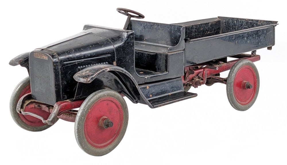 Original Buddy L Chain Drive Dump Truck: Original Buddy L chain drive dump truck. An all original truck with paint loss and war from play / age. Most of the paint loss being in the bed of the truck. The radiator decal and floor decal are sti