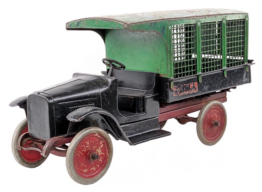 Buddy L Express Line Screen Side Truck: Buddy L Express Line screen side truck. The truck has some old overpaint on the cab and the passenger side wheels. The screen side has the original rear doors intact. The truck has paint loss, decal