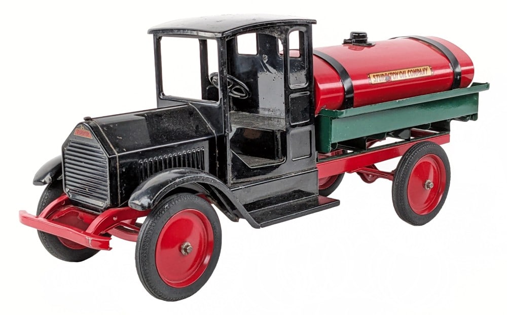 Sturditoy Oil Company Tanker Truck: Partially restored Sturditoy Oil Company tanker truck. The black cab appears to be original while the frame, tank, and green bed have been restored. The tank and bed have had some paint chips / rub ma