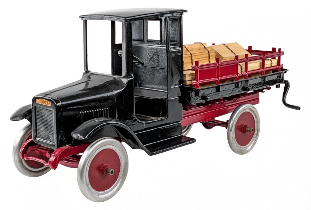 Restored Buddy L Lumber Hauler Truck: Restored Buddy L lumber hauler truck. The truck has an older restoration with some pitting and age wear showing. Displays well with custom load of lumber. An original truck that has been restored. Mea