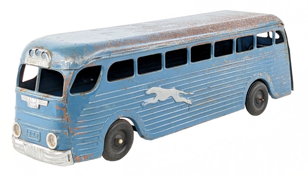 Original Keystone Windup Greyhound Bus: Original Keystone toys windup Greyhound bus. The bus has paint loss and wear from play / age. The windup mechanism works as it should. Measures approximately 18" long.