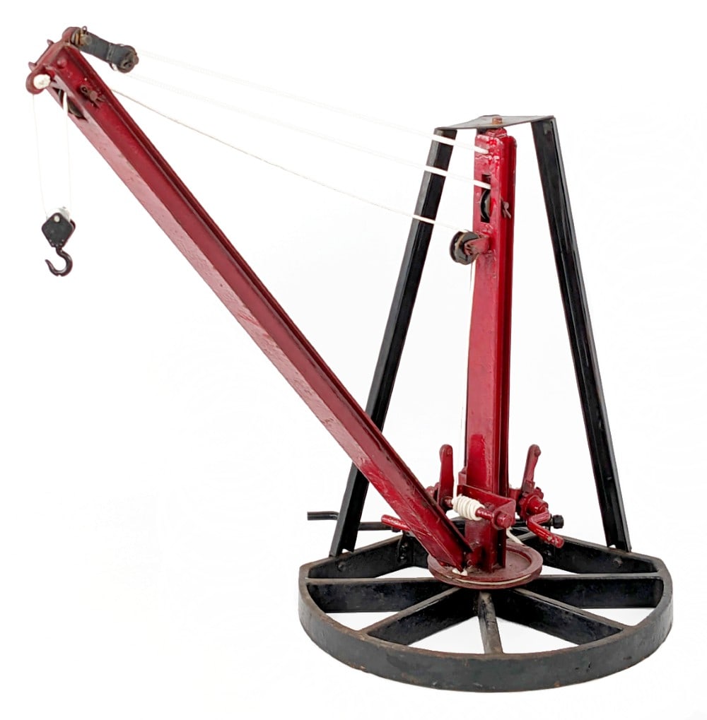 Buddy L Small Derrick on Swivel Base: Buddy L small derrick on swivel base. The string has been replaced and one of the three support poles has been repaired where it connects to the top. The red boom has thick paint crazing, but the