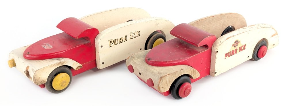 (2) Buddy L Wood Toys Pure Ice Trucks: (2) Buddy L wood toys Pure Ice trucks. The trucks have different decals and different color wheels. The one is missing one of the headlights. Both have paint loss and wear from play and age. Each