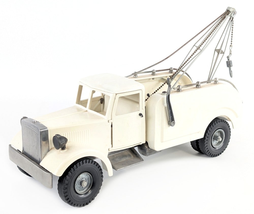 Repainted Smith Miller MIC Wrecker Tow Truck: Repainted Smith Miller MIC wrecker tow truck. The truck has an older repaint / restoration. Overall it is in good condition with some dust and light wear from display. Measures approximately 17" long.