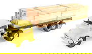 Smith Miller GMC Lumber Hauler Truck: Smith Miller GMC lumber hauler truck. The truck has paint chips on the cab. It has custom tires on the truck and a custom load of lumber. Measures approximately 23" long.
