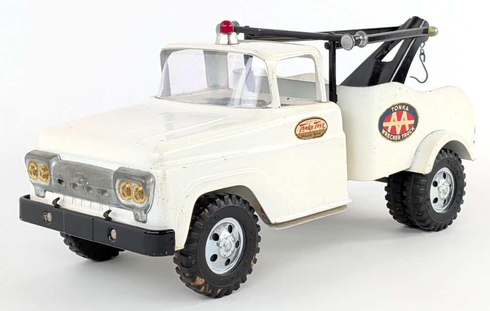 Original Tonka AA Wrecker Tow Truck: Original Tonka AA wrecker tow truck. Overall good condition with some light paint loss and play wear. Displays well with good decals. Measures approximately 13" long.