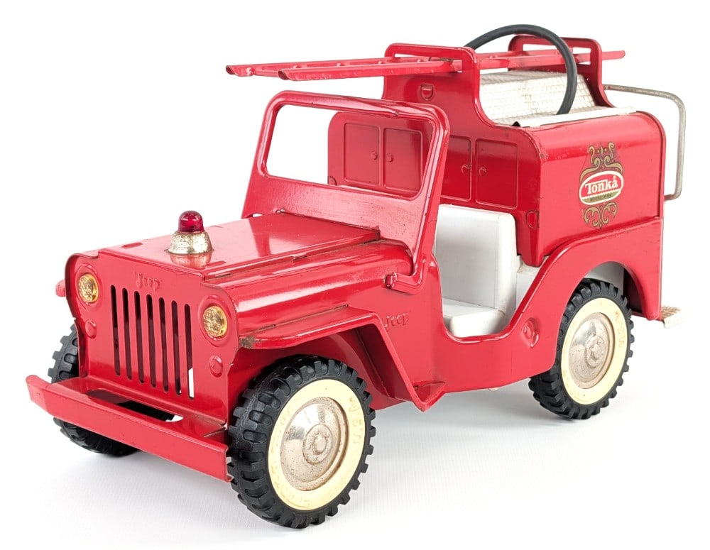 Original Tonka Jeep Pumper Fire Truck: Original Tonka Jeep Pumper fire truck. The truck has some very minor paint loss on the hood and edge wear. It does have a small bend in the front bumper. Measures approximately 10-1/2" long.