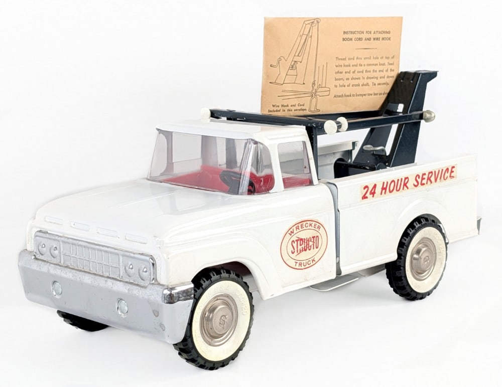 Original Structo 24 Hour Service Wrecker Tow Truck: Original Structo 24 Hour Service Wrecker tow truck. The truck still has the original bag for the moob cord and wire hook that is factory sealed. Overall a very nice original example that is just