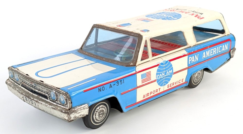 Japan Tin Friction Ford Pan American Airport Service Car: Japan tin litho friction Ford Pan American Airport Service car. The friction motor is in working order. The car shows oxidation to the chrome features and scratches / light wear from play and age.