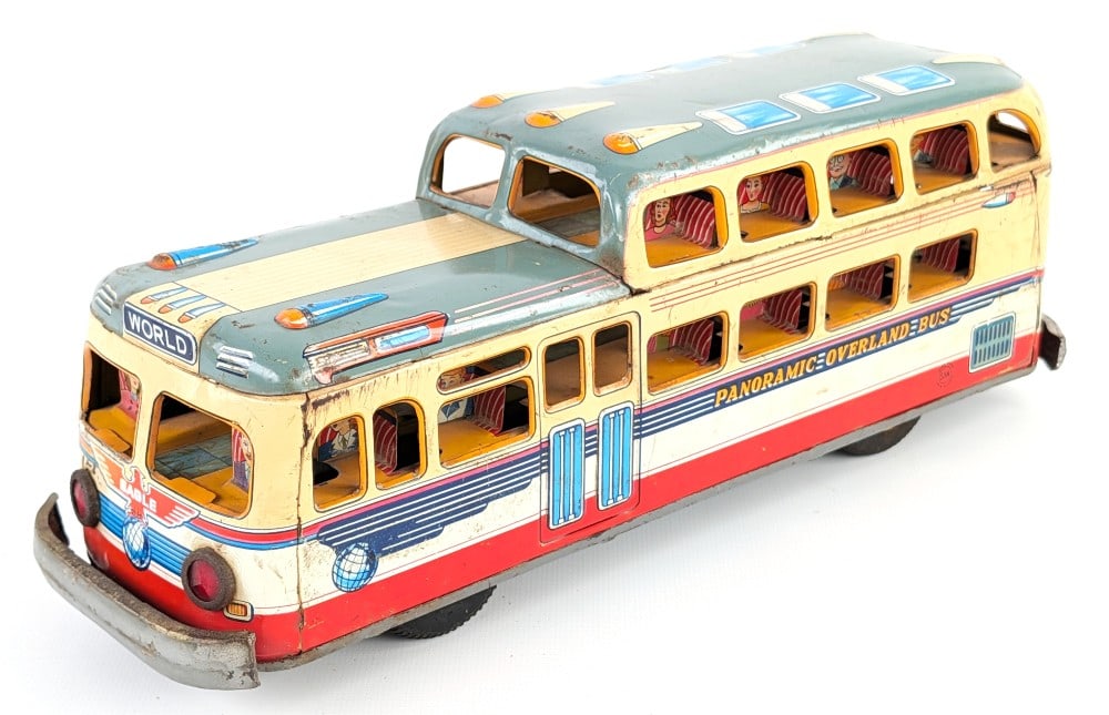 Marusan Tin Friction Panoramic Overland Bus: Marusan tin friction Panoramic Overland bus. The bus is missing one of the rear hubcaps. It shows paint loss and wear from play and age. The friction doesn't work very well. A double decker style bus