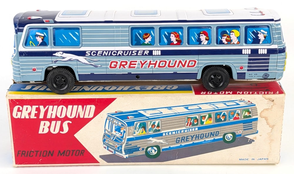 Japan Tin Friction Greyhound Bus w/ Box: Japan tin friction Greyhound bus with the original box The bus is in excellent condition overall. The box has some water staining on the one end, but is in good condition otherwise. Measures approxima