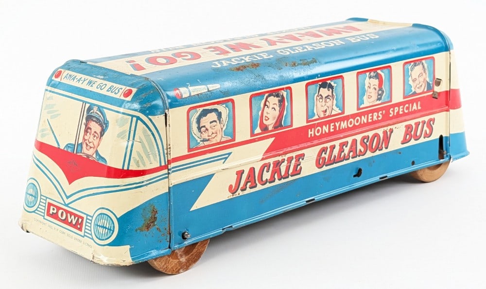 Wolverine Tin Windup Jackie Gleason Bus "The Honeymooners": Wolverine tin windup Jackie Gleason bus "The Honeymooners". The push down windup mechanism doesn't work very well. It does have some scratches and a dent in the rear of the bus. An unusual and hard