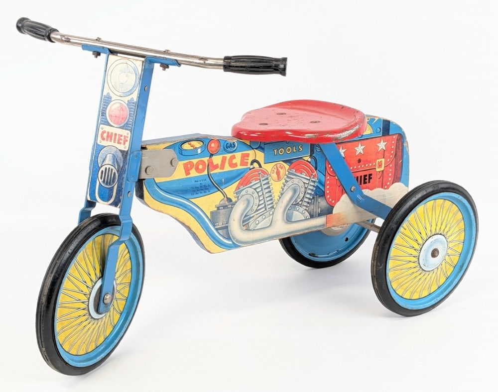 Original Gong Bell MFG. Police Ride On Motorcycle: Original vintage Gong Bell MFG. Police Chief ride on motorcycle / tricycle. The motorcycle displays very well with great colors and graphics. It does have some discoloration, paint loss, and wear from