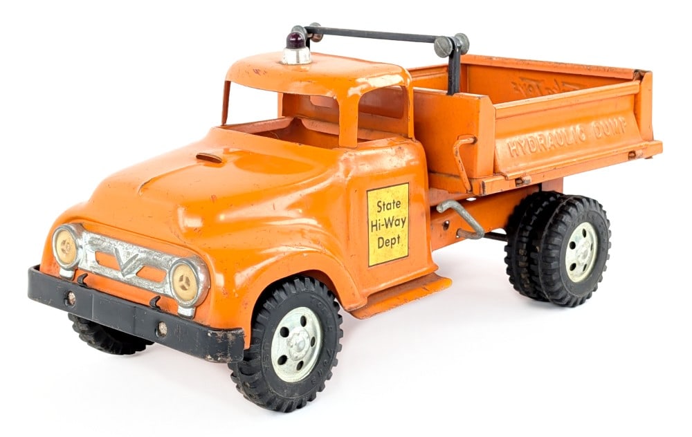 Original Tonka State Hi-Way Dept Hydraulic Dump Truck: Original Tonka State Hi-Way dept hydraulic dump truck. The truck has paint loss, scuff marks, and wear from play / age. The hydraulic dump works. Measures approximately 13" long.