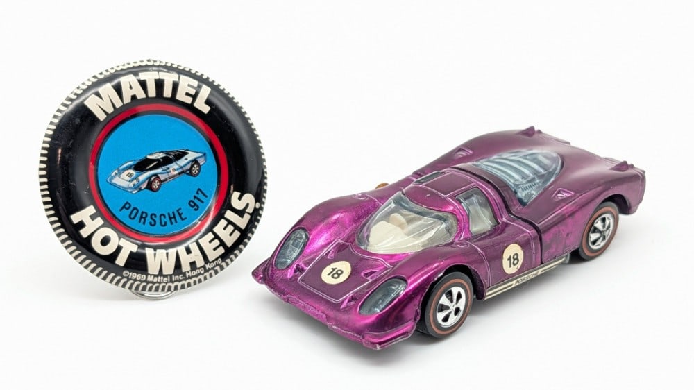 Hot Wheels Redline Magenta Porsche 917 w/ Button: Hot Wheels Redline magenta Porsche 917 with metal button. The car is U.S. and the button is Hong Kong. The car is in excellent condition overall with minimal wear to the decals.