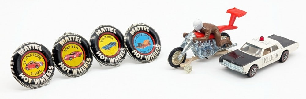 Hot Wheels Redline Cruiser, Rrrumblers High-Tailer, and (4) Buttons: Hot Wheels Redline Police Cruiser, Rrrumblers High-Tailer, and four Redline buttons. The buttons include a Ford MK IV, Splittin' Image, '36 Ford Coupe, and Heavyweights Cement Mixer. The Cruiser has