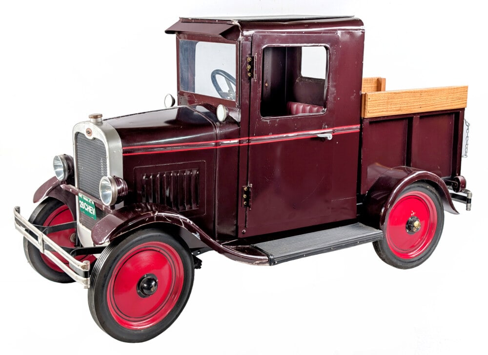 Custom 1928 Chevrolet Pickup Truck Pedal Car: Very unique one of a kind custom 1928 Chevrolet pickup truck pedal car. The truck is heavy and made of mostly metal. It features a rear bed with drop down tailgate, both doors on the cab are hinges an