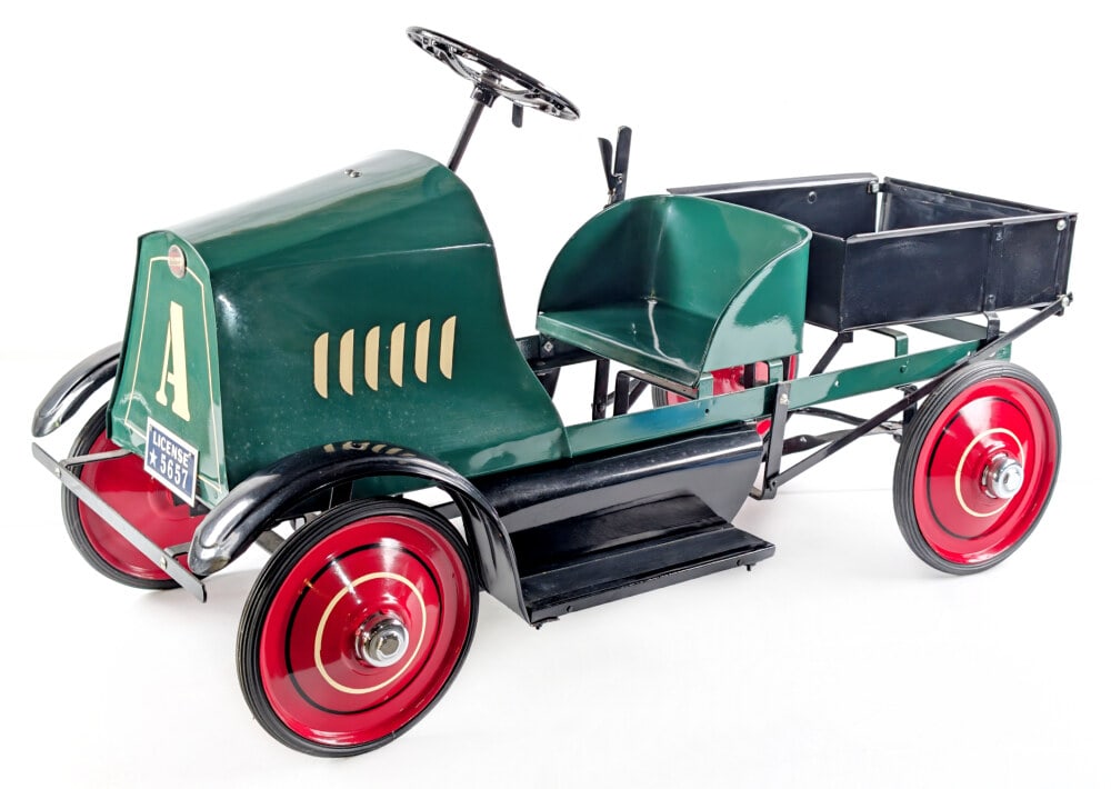 Restored American National Mack Dump Truck Pedal Car: Professionally restored American National Mack dump truck pedal car. The truck features a crank horn, dump bed with manual lever and a nice paint job. The truck still has the original American