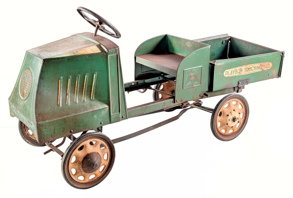 Original Steelcraft Mack Playboy Trucking Co. Dump Truck Pedal Car: Hard to find original Steelcraft Mack Playboy Trucking Co. dump truck pedal. The truck is in the hard to find green color. It is missing one rear hubcap. The truck displays well with original Mack