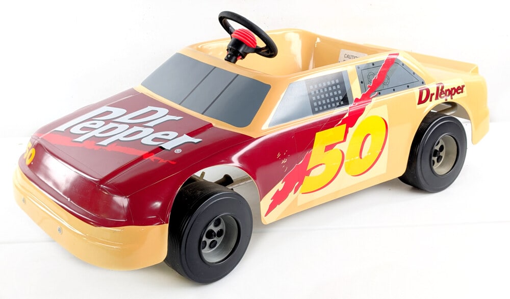 Nascar #50 Dr. Pepper Electric Childs Ride On Car: Nascar #50 Dr. Pepper Electric Childs Ride On Car. The car has some scuffs and rub marks from use and handling. Untested condition. Measures approximately 46" long.