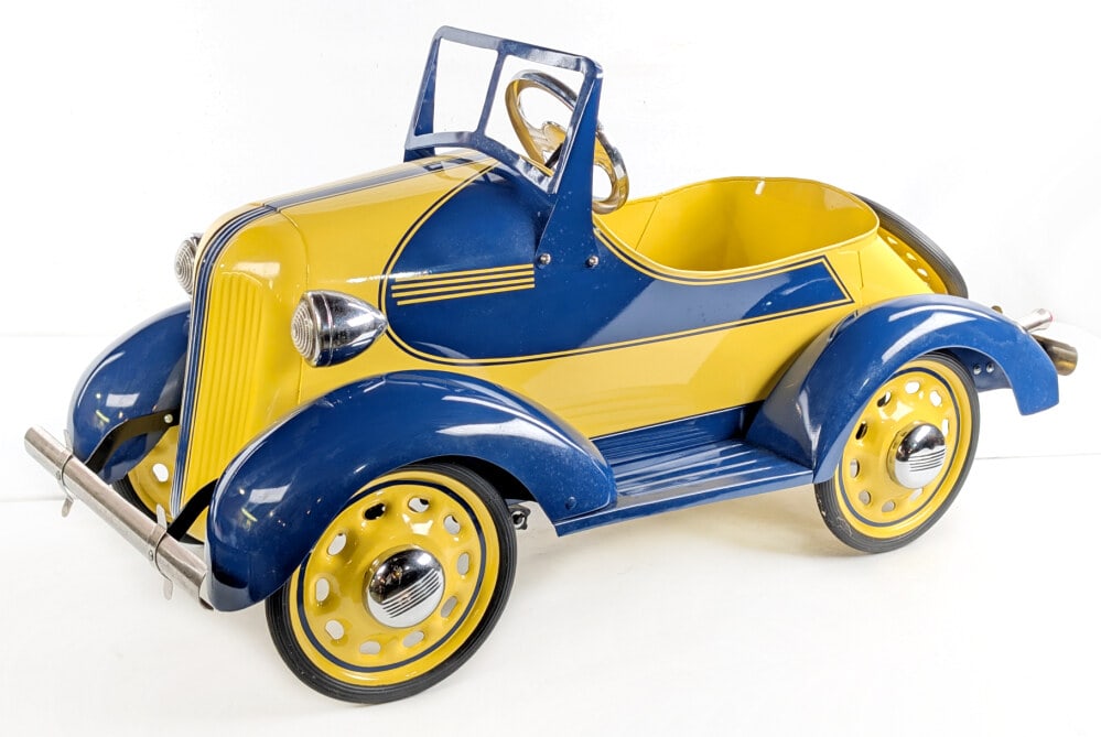 Restored Garton Pontiac Pedal Car: Professionally restored Garton Pontiac pedal car. The car has a very nice paint job with chrome features and rear mounted spare tire. Good condition and displays very well. Measures approximately 45"