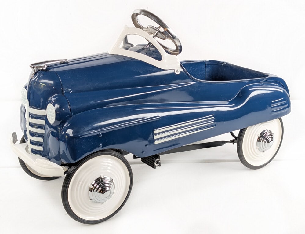 Restored Steelcraft Pontiac Pedal Car: Professionally restored Steelcraft Pontiac pedal car. The car has a nice restoration. Displays well in blue overall with white wheels and chrome hubcaps. Measures approximately 36" long.
