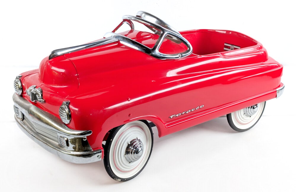 Restored Murray Buick Torpedo Pedal Car: Professionally restored Murray Buick Torpedo pedal car. The car has some wear to the chrome from storage and display. Measures approximately 36" long.