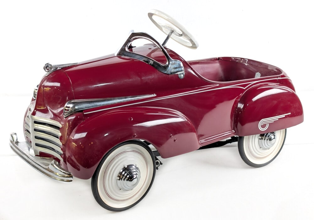 Restored Steelcraft Chrysler Pedal Car: Professionally restored Steelcraft Chrysler pedal car. The car has a nice restoration and displays well with chrome features. Good condition overall. Measures approximately 36" long.