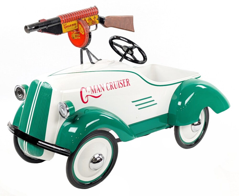 Restored G-Man Cruiser Pedal Car: Very nice custom restored G-Man Cruiser pedal car. The car features a tin windup G-Man gun and a high quality restoration. Overall a great car that displays very well. Good condition. Measures approxi