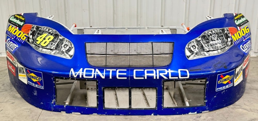 Jimmy Johnson's Monte Carlo SS NASCAR Front Nose Clip / Hendrick / Race Used: Jimmie Johnson’s Monte Carlo SS race used NASCAR nose clip. Has decal loss, paint loss, scratches, race damage, surface rust, and wear from use and age. Displays well. Here your chance to own a