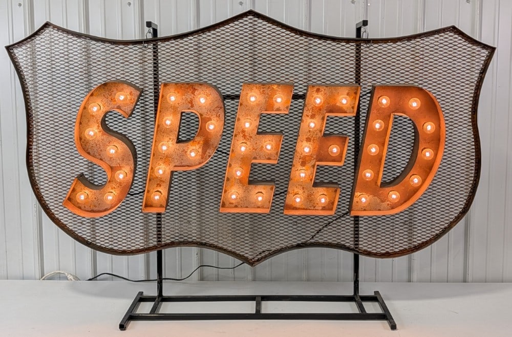 5-1/2ft Custom Speed Lighted Marquee Sign / Racing / Garage Sign: Large custom made metal "SPEED" racing lighted marque sign. Appears to be in good condition with surface rust, and wear from display. Includes custom made base for easy display. It measures
