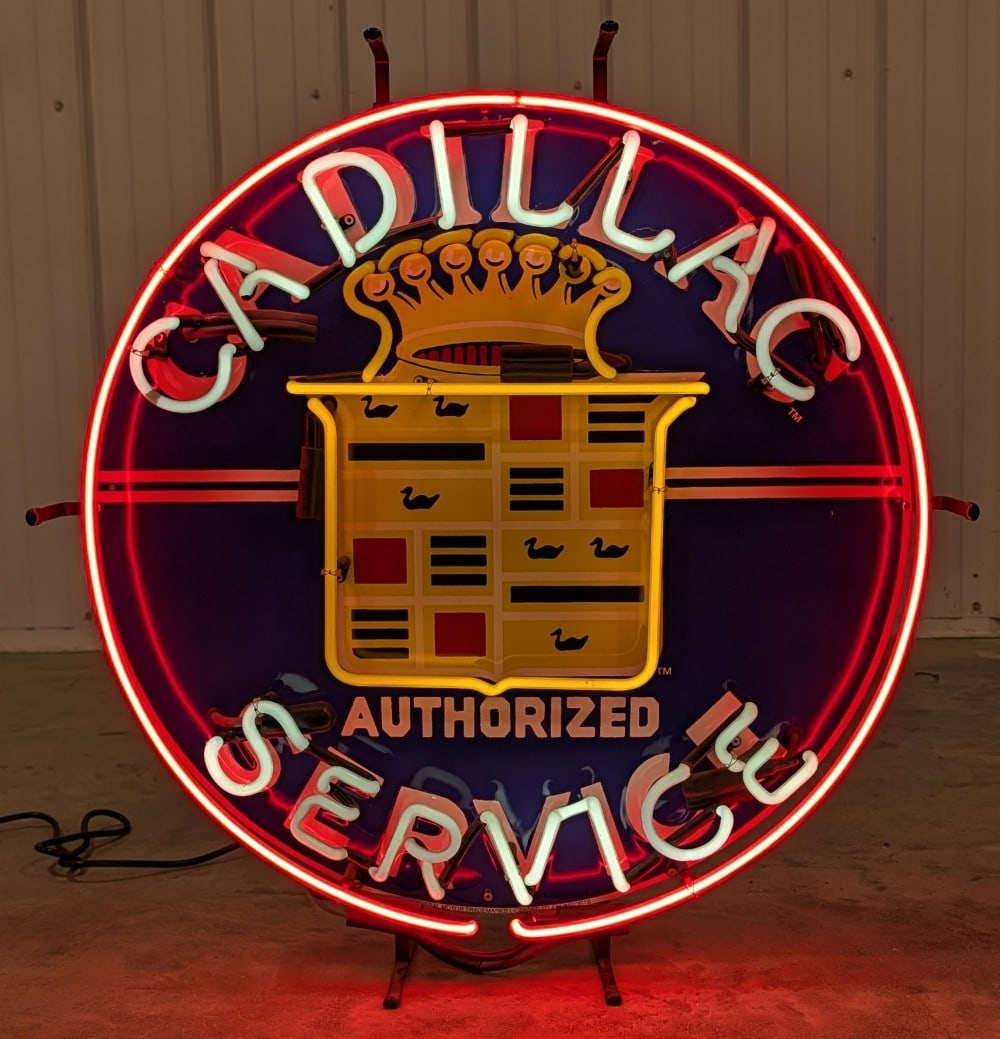 Custom SST Cadillac Service Embossed Neon Sign: Custom single sided embossed tin Cadillac Service neon advertising sign. Appears to be in good condition with some scratches and wear form display and storage. It measures approximately 24in in diamet