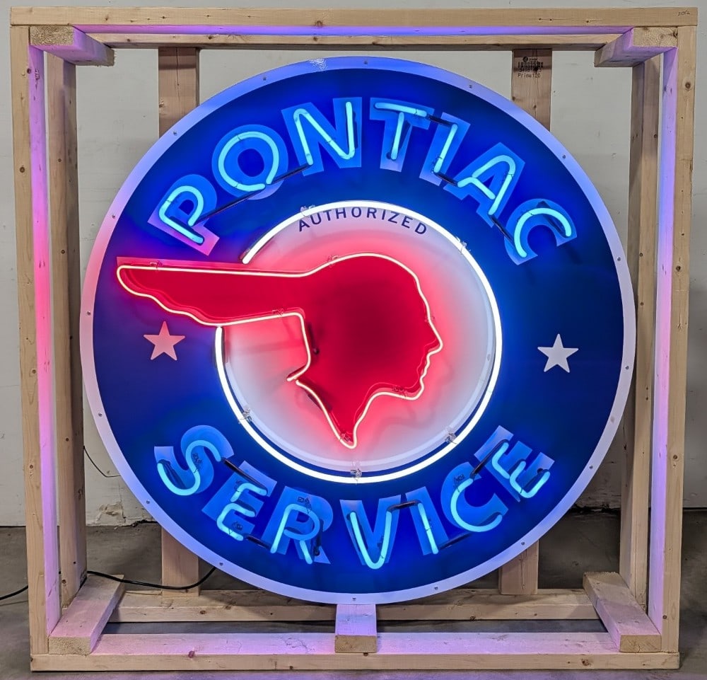 4ft Custom Pontiac Neon Sign: Single sided tin custom Pontiac neon advertising sign. Sign features high gloss shine, new neon glass,and transformers. Easily displayed with die cut can featuring hanging brackets. Has been nicely cr
