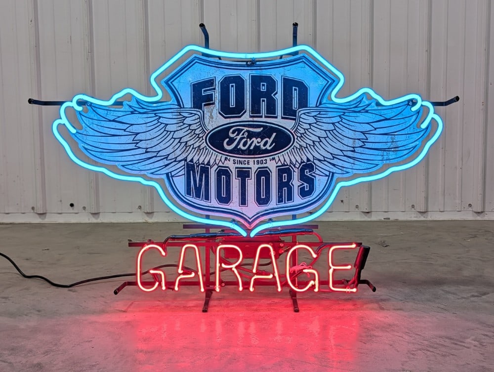 Custom Ford Motors Garage Neon Sign: Custom Ford Motors Garage neon sign. It features 2-color neon on die-cut embossed tin sign. Nice condition with light wear from display and storage. It measures approximately 33in? across by 21in
