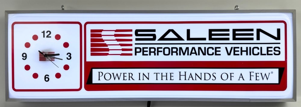 Custom Saleen Performance Vehicles Lighted Dealership Style Clock / Saleen Mustang: Custom Saleen Performance Vehicles lighted dealership style advertising clock / sign. Features a metal can, plastic / acrylic face, and battery operated clock mechanism. Appears to be in nice working